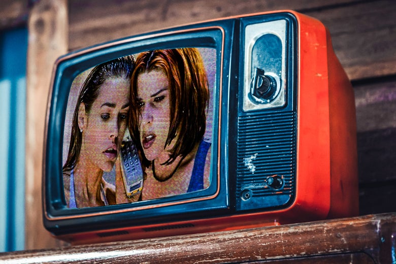 A photo illustrated still of Denise Richards and Neve Campbell in Wild Things, as seen in an old-fashioned TV.